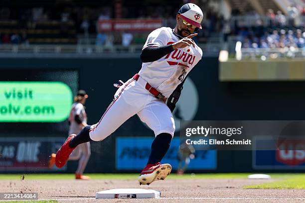 Byron Buxton of the Minnesota Twins rounds third base before scoring in the first inning of a game against the Baltimore Orioles at Target Field on...