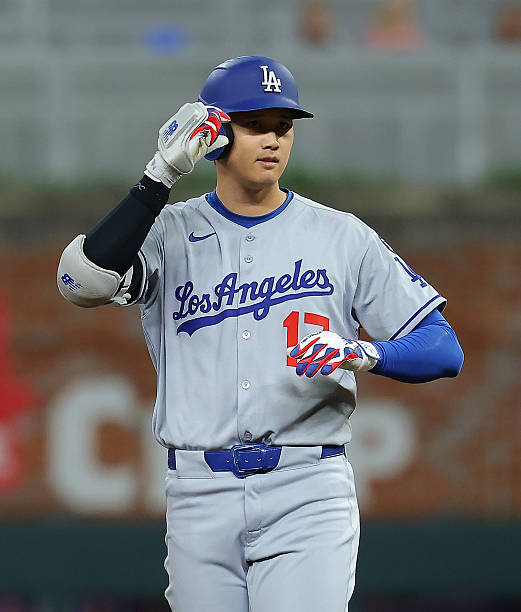 Shohei Ohtani of the Los Angeles Dodgers reacts after hitting a double in the seventh inning against the Atlanta Braves at Truist Park on May 04,...