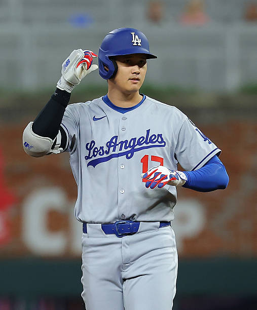 Shohei Ohtani of the Los Angeles Dodgers reacts after hitting a double in the seventh inning against the Atlanta Braves at Truist Park on May 04,...