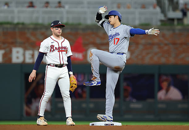 Shohei Ohtani of the Los Angeles Dodgers reacts after hitting a double in the seventh inning against the Atlanta Braves at Truist Park on May 04,...