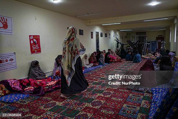 People take refuge in a college in Uri town, Baramulla district, north of Srinagar, Indian-administered Kashmir, on May 8 following cross-border...