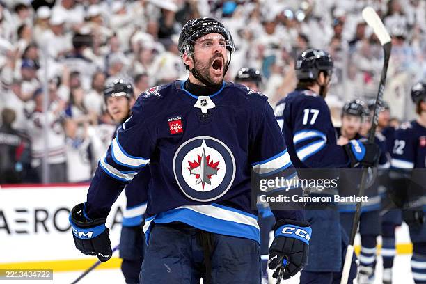 Dylan DeMelo of the Winnipeg Jets celebrates the 4-3 win against the St. Louis Blues in double overtime to win Game Seven of the First Round of the...