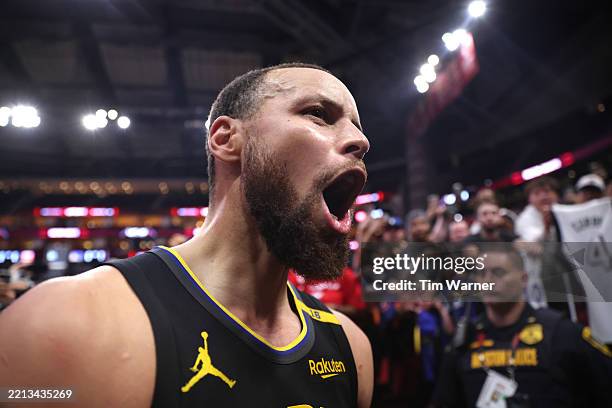 Stephen Curry of the Golden State Warriors reacts after defeating the Houston Rockets 103-89 in Game Seven of the Western Conference First Round NBA...