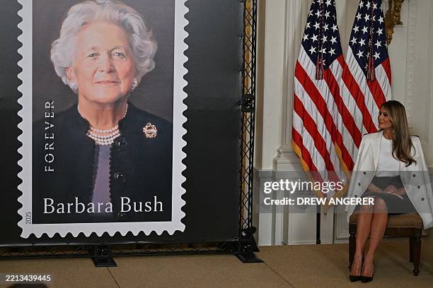 First Lady Melania Trump attends the unveiling of a US Postal Service stamp of former First Lady Barbara Bush in the East Room of the White House on...