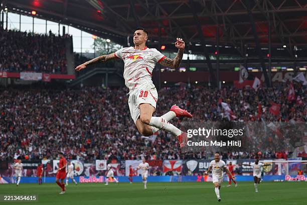 Benjamin Sesko of RB Leipzigcelebrates scoring his team's first goal during the Bundesliga match between RB Leipzig and FC Bayern München at Red Bull...
