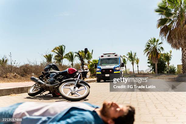 ambulance arriving on motorcycle accident at street - accident victim stock pictures, royalty-free photos & images
