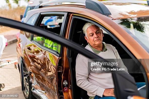 senior man injured and unconscious inside car after accident - unconscious stock pictures, royalty-free photos & images