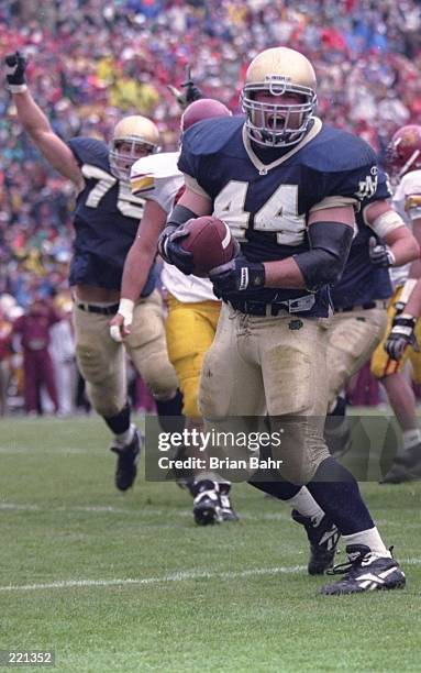 Fullback Marc Edwards of the Notre Dame Fighting Irish celebrates as he enters the end zone, scoring a touchdown, during the Fighting Irish's 38-10...