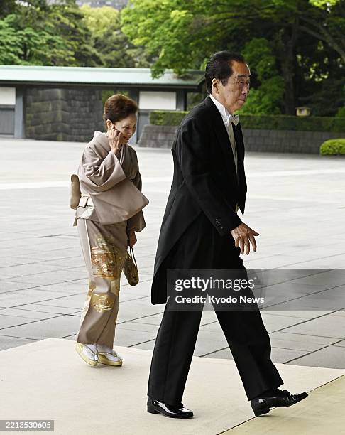 Former Japanese Prime Minister Naoto Kan heads to a ceremony to receive the Grand Cordon of the Order of the Paulownia Flowers at the Imperial Palace...