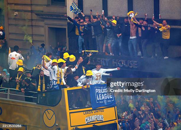 Leeds United players celebrate on the bus with the fans during the Championship Celebration Parade on The Headrow on May 05, 2025 in Leeds, England.