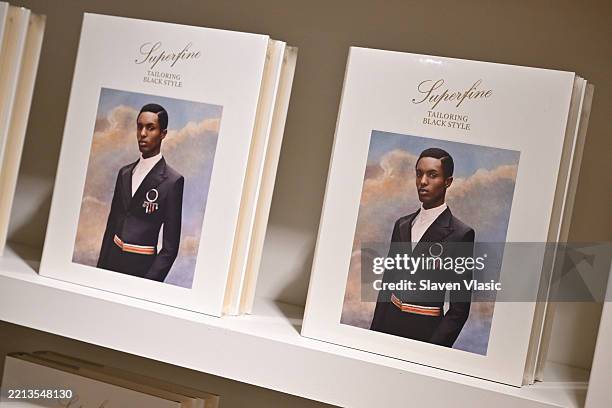 View of the 2025 Met Gala catalog on display at the press conference for the 2025 Met Gala celebrating "Superfine: Tailoring Black Style" at...