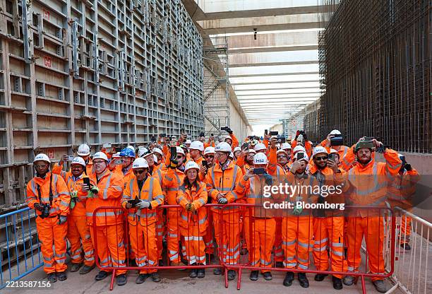 Workers watch the tunnel boring machine breakthrough at the Washwood Heath HS2 High-Speed railway construction site in Birmingham, UK, on Friday, May...