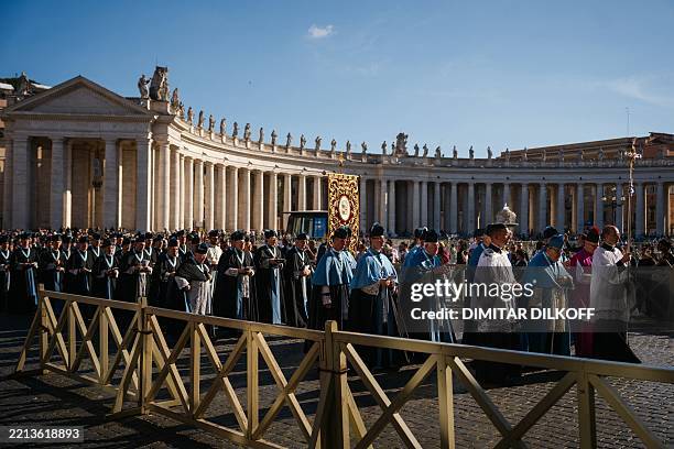 Pilgrims from The Institute of Christ the King Sovereign Priest take part in a procession as they enter St Peter's Square in the Vatican on May 9,...