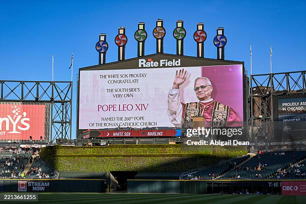 The outfield video board displays a congratulatory message for Pope Leo XIV before the game between the Miami Marlins and the Chicago White Sox at...
