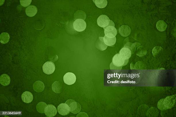 festive horizontal blank empty vector weathered run down plastered wall like background in dark green color with full frame shimmering glitter like defocused bokeh lights - christmas lights green screen stock illustrations