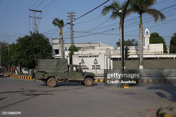 Pakistani security forces are seen outside Nur Khan Air Base, where an Indian missiles struck in Rawalpindi, Pakistan, on May 10, 2025. India...