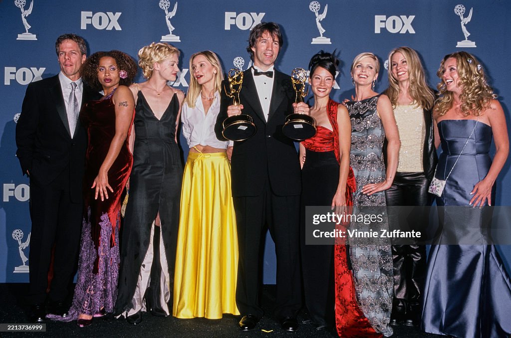 Writer Ast Producer and writer David E Kelley holding two trophies as he poses ...
