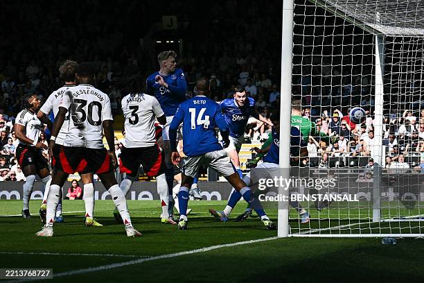 Everton's English defender Michael Keane scores his team second goal during the English Premier League football match between Fulham and Everton at...