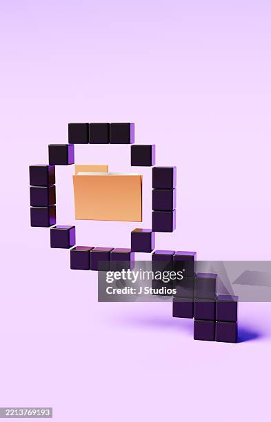 magnifying glass made of large pixels focusing on computer file folder symbolizing digital data investigation - file sharing stock pictures, royalty-free photos & images