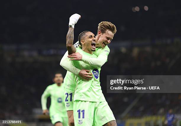 Raphinha of FC Barcelona celebrates with teammate Frenkie de Jong after scoring his team's third goal during the UEFA Champions League 2024/25 Semi...