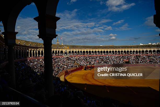 People attend a bullfight at La Maestranza bullring in Seville on May 10, 2025.