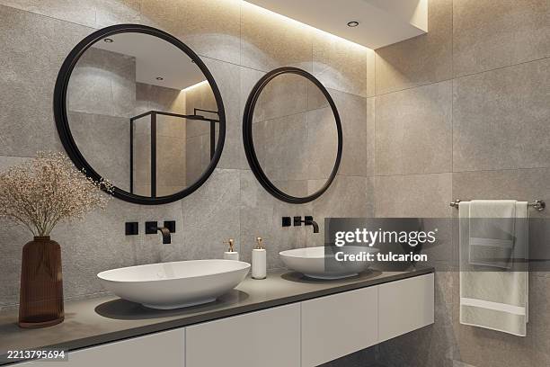 modern spa-inspired bathroom with dual sinks and natural stone tiles - espelho de barbear imagens e fotografias de stock