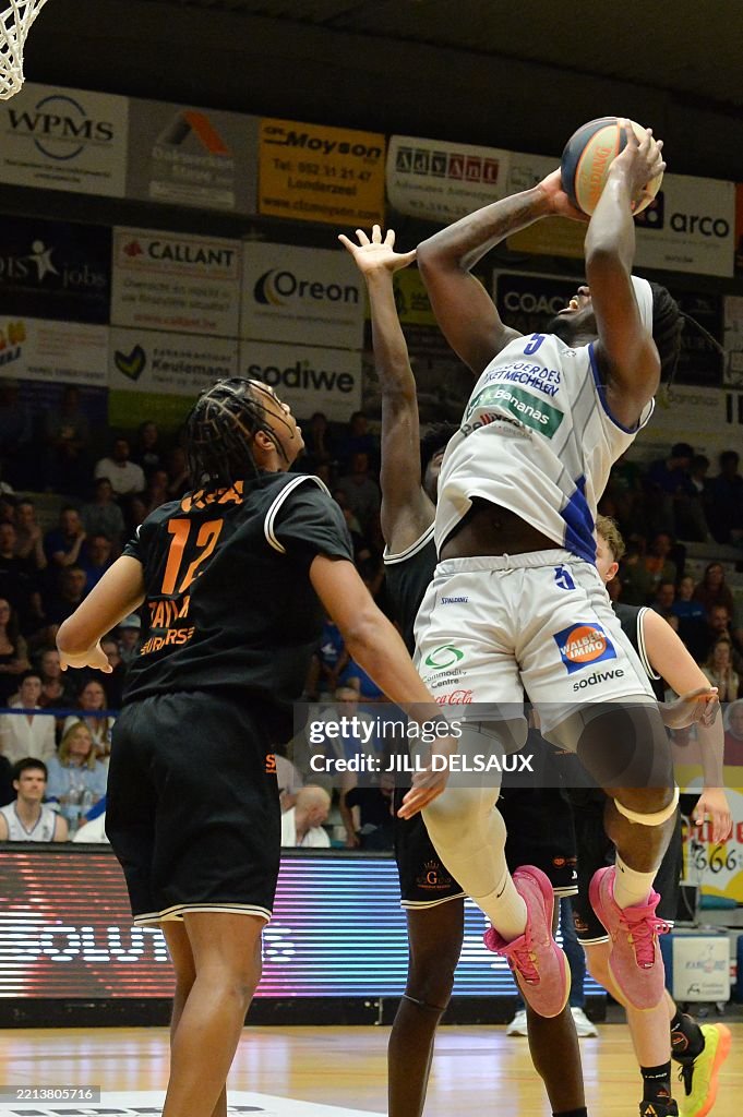 Qsta QSTA's Evan Taylor and Mechelen's Zaba Bangala pictured in action ...