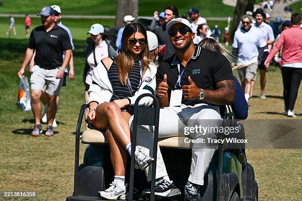 Philadelphia Eagles running back, A.J. Dillon gives a thumbs up as he rides in a golf cart during the third round of Truist Championship at The...