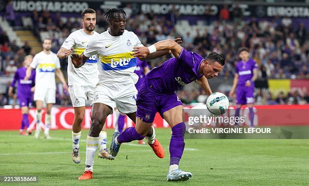 Union's Promise David and Anderlecht's Jan-Carlo Simic fight for the ball during a soccer match between RSC Anderlecht and Royale Union...