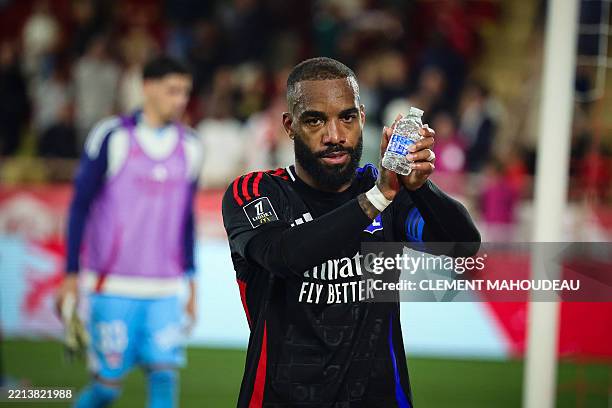 Lyon's French forward Alexandre Lacazette reacts at the end of the French L1 football match between AS Monaco and Olympique Lyonnais at the Louis II...