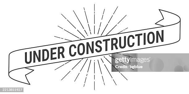 under construction - banner with sunbursts on white background - construction in progress stock illustrations