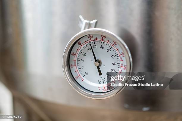 close-up of thermometer gauge on brewing tank - f water stock pictures, royalty-free photos & images