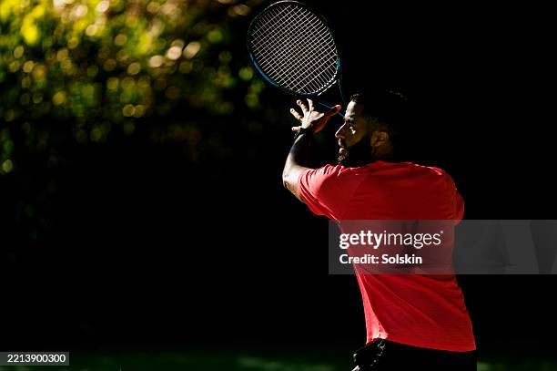 male tennis player getting ready for a forehand stroke - racket sport stock pictures, royalty-free photos & images