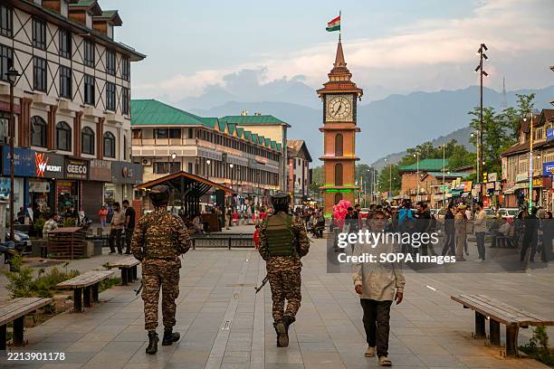 Indian paramilitary soldiers patrol a street. Pakistan and India agreed to a full and immediate ceasefire on May 10 after days of deadly jet fighter,...