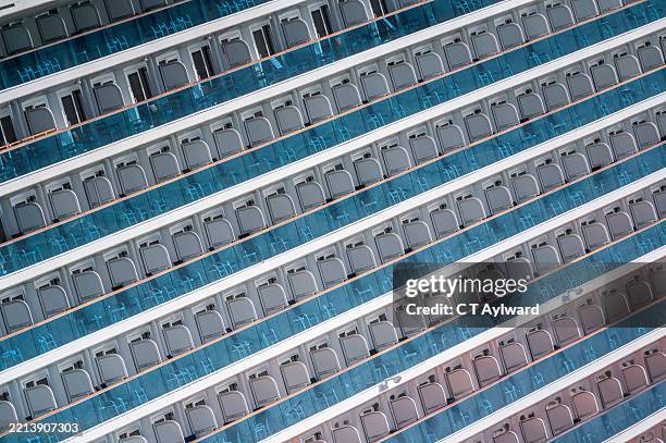 rows of balconies on cruise ship - cruise ship interior stock pictures, royalty-free photos & images