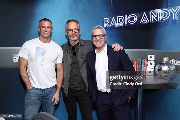 John Benjamin Hickey poses for a photo with John Hill and Andy Cohen during a visit to SiriusXM's Andy Cohen LiveHickey visits the SiriusXM Studios...