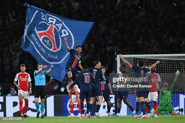 Marquinhos of Paris Saint-Germain celebrates victory with teammate Ousmane Dembele as Referee Felix Zwayer blows the final whistle of the UEFA...