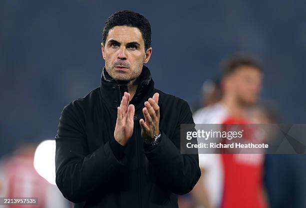 Mikel Arteta, Manager of Arsenal, applauds the fans at full-time following the team's defeat and subsequent elimination after the UEFA Champions...