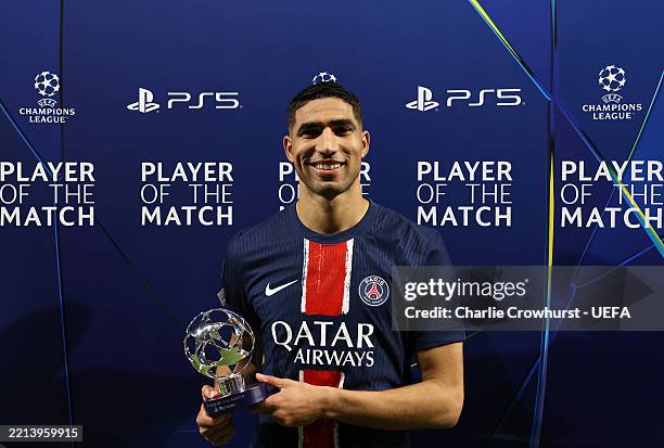 Achraf Hakimi of Paris Saint-Germain poses for a photo with the PlayStation Player Of The Match award after the team's victory and subsequent...
