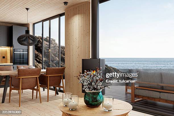 interior de cabaña de madera escandinava con espacio abierto y vista al mar - interior del vehículo fotografías e imágenes de stock