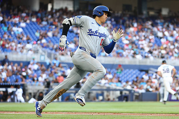 Shohei Ohtani of the Los Angeles Dodgers runs the bases after hitting a triple against the Miami Marlins in the sixth inning at loanDepot park on May...