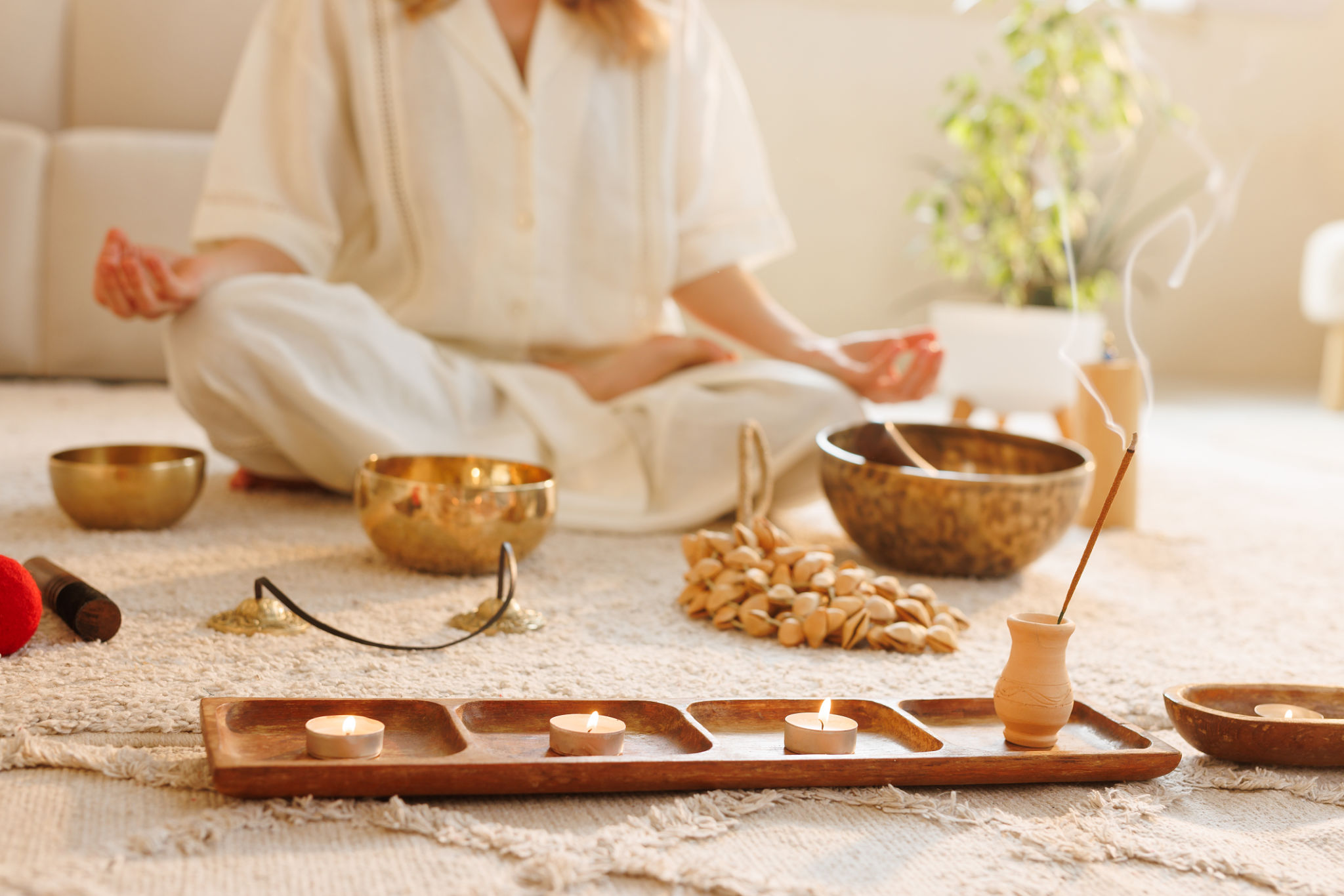 Meditation scene with incense, candles, and singing bowls in a calming home environment. Meditation scene with incense, candles, and singing bowls in a calming home environment.