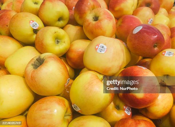 Presentation of fresh apples in a grocery store, photographed on May 7 in Edmonton, Alberta, Canada.