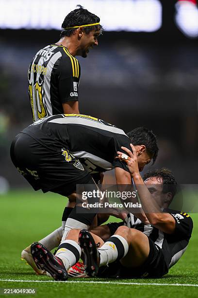 Gustavo Scarpa, Alan Franco and Igor Gomes of Atletico Mineiro celebrate after winning the match between Atletico Mineiro and Fluminense as part of...