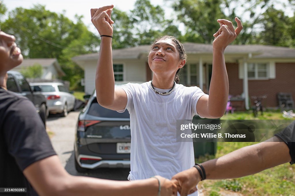 Teen making playful dapping gestures