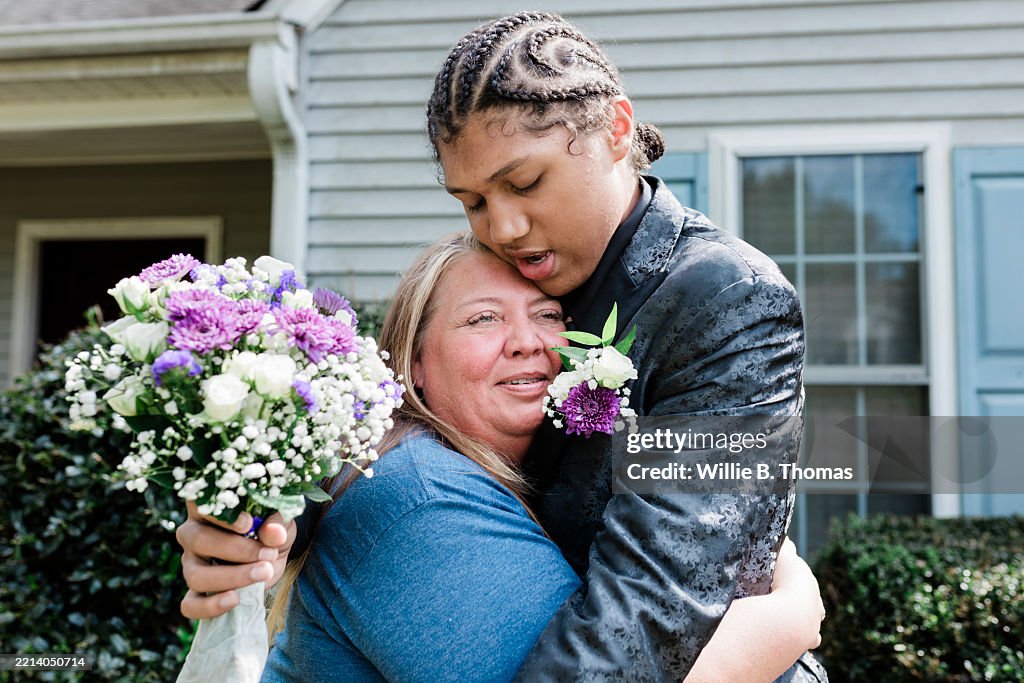 Emotional prom send-off hug