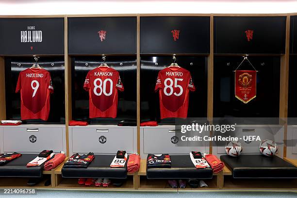 The match shirts of Rasmus Hojlund, Jaydan Kamason and Bendito Mantato hang next to the match pennant inside the Manchester United dressing room...