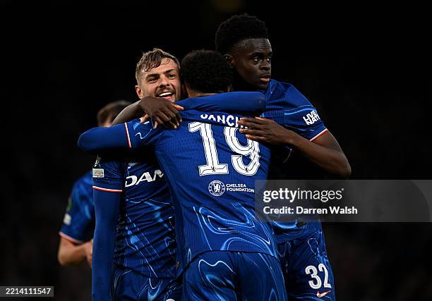 Kiernan Dewsbury-Hall of Chelsea celebrates scoring his team's first goal with teammates Jadon Sancho and Tyrique George during the UEFA Conference...