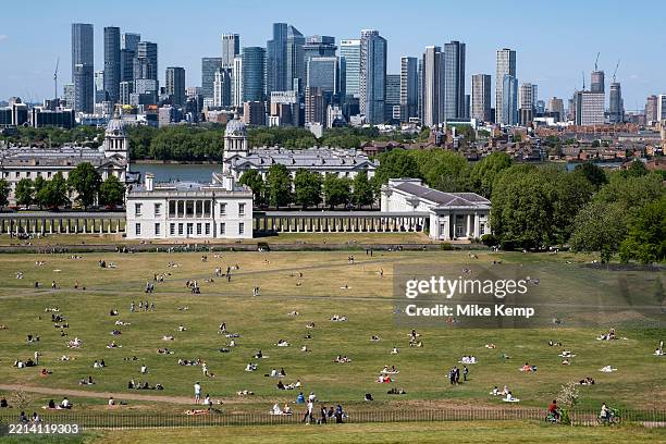 Skyline view of Canary Wharf financial district beyond the National Maritime Museum and the Old Royal Naval College from the viewpoint in Greenwich...