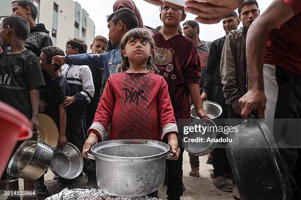 Charity organization distributes food and drinking water to Palestinians in the Jabalia area in the north of the Gaza on May 12, 2025. Since March 2,...